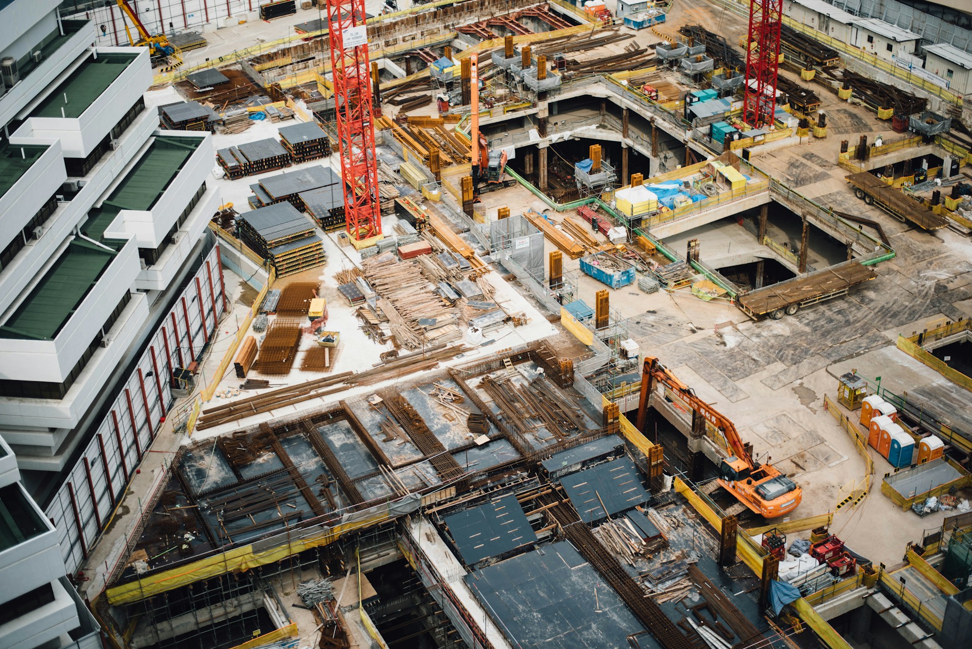Construction site cranes and workers